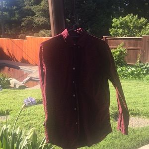 Men’s button down long sleeve shirt.